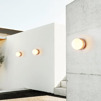 Modern Round Wall Lamp with Travertine Stone Base and Frosted Glass Shade